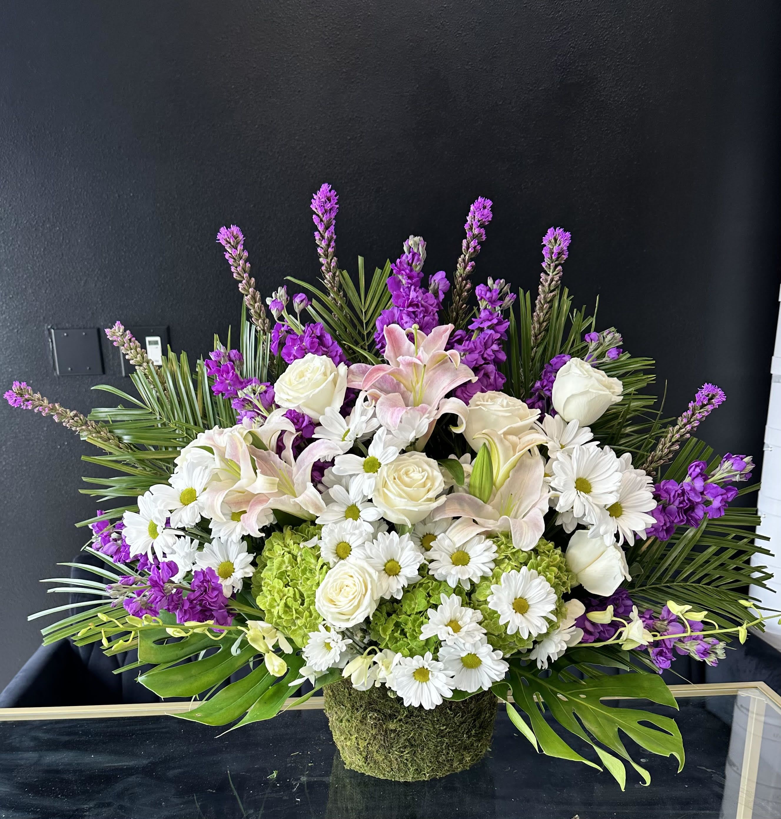 Spring Morning  - This colorful and bright funeral basket is representative of a life lived to its fullest. Fitting for any type of service, colors and flowers may change based off of season and availability. 