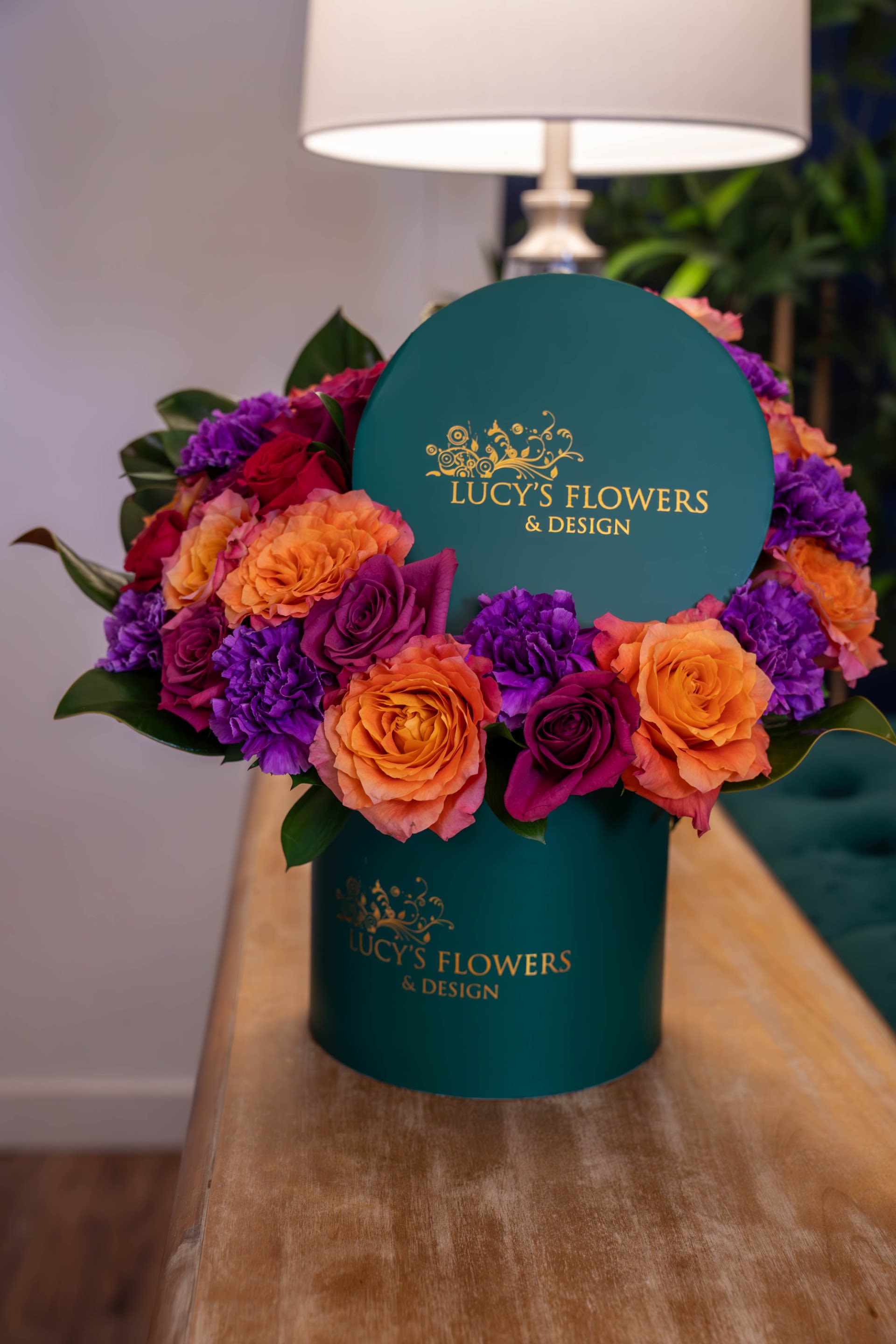 Vivid Bloom - A striking luxury box arrangement designed with a vivid mix of premium blooms in bold jewel-toned hues. Featuring vibrant roses and richly layered florals, this arrangement brings together playful color, modern elegance, and artistic design in our signature emerald box. Arrangement Includes: -Fresh Cut Roses and Other Blooms -Lucy's Signature Small Size Box -Custom Greeting Card -Care Instructions 
