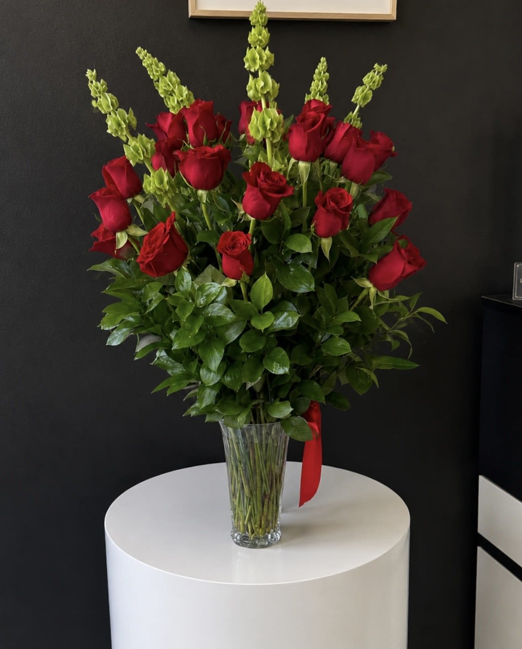 Grandeur Long Stem Rose Arrangement  - Go big with your love. Send the most extravagant 2 dozen red rose arrangement for Valentine's day, anniversary celebrations, or declarations of love. This luxury arrangement makes a big statement of "I love you" in 25 roses.  Approximate Dimensions: 20"D x 32"H