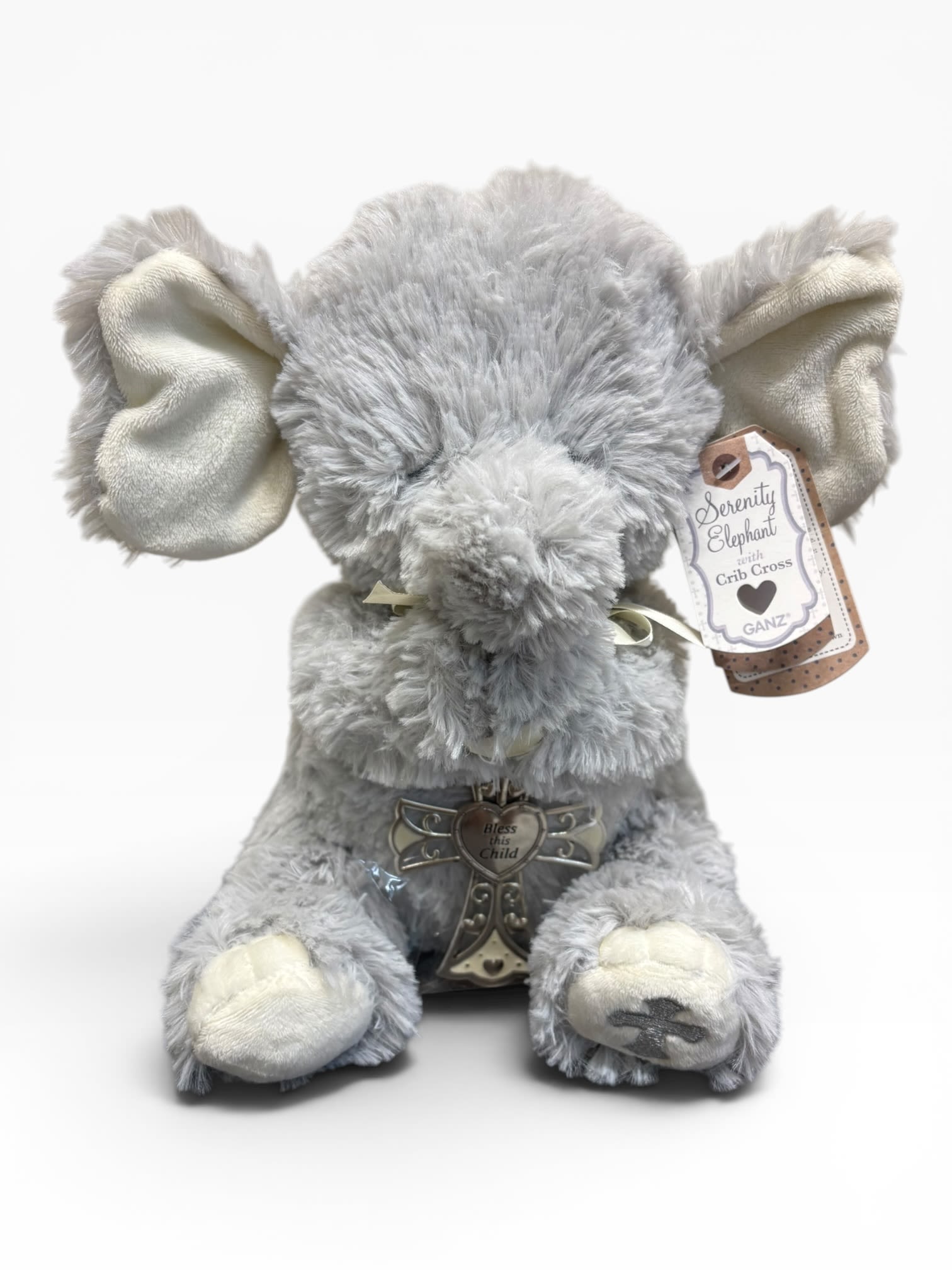 Serenity Elephant with Crib Cross - The sweetest, softest, adorable elephant plush, embroidered eyes and embroidered cross on foot, holding a keepsake crib cross that reads "Bless This Child". 