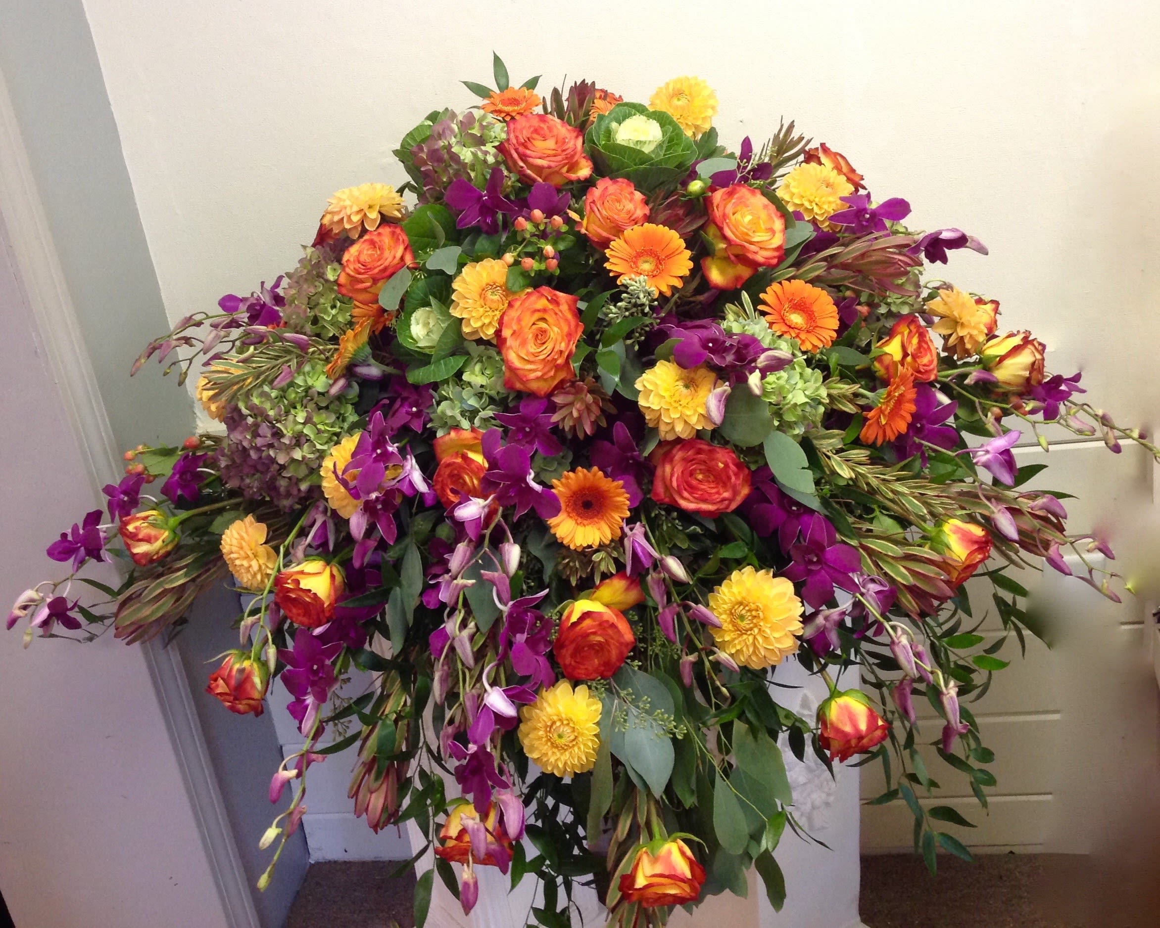 Large mixed bouquet with orange, yellow, and purple flowers