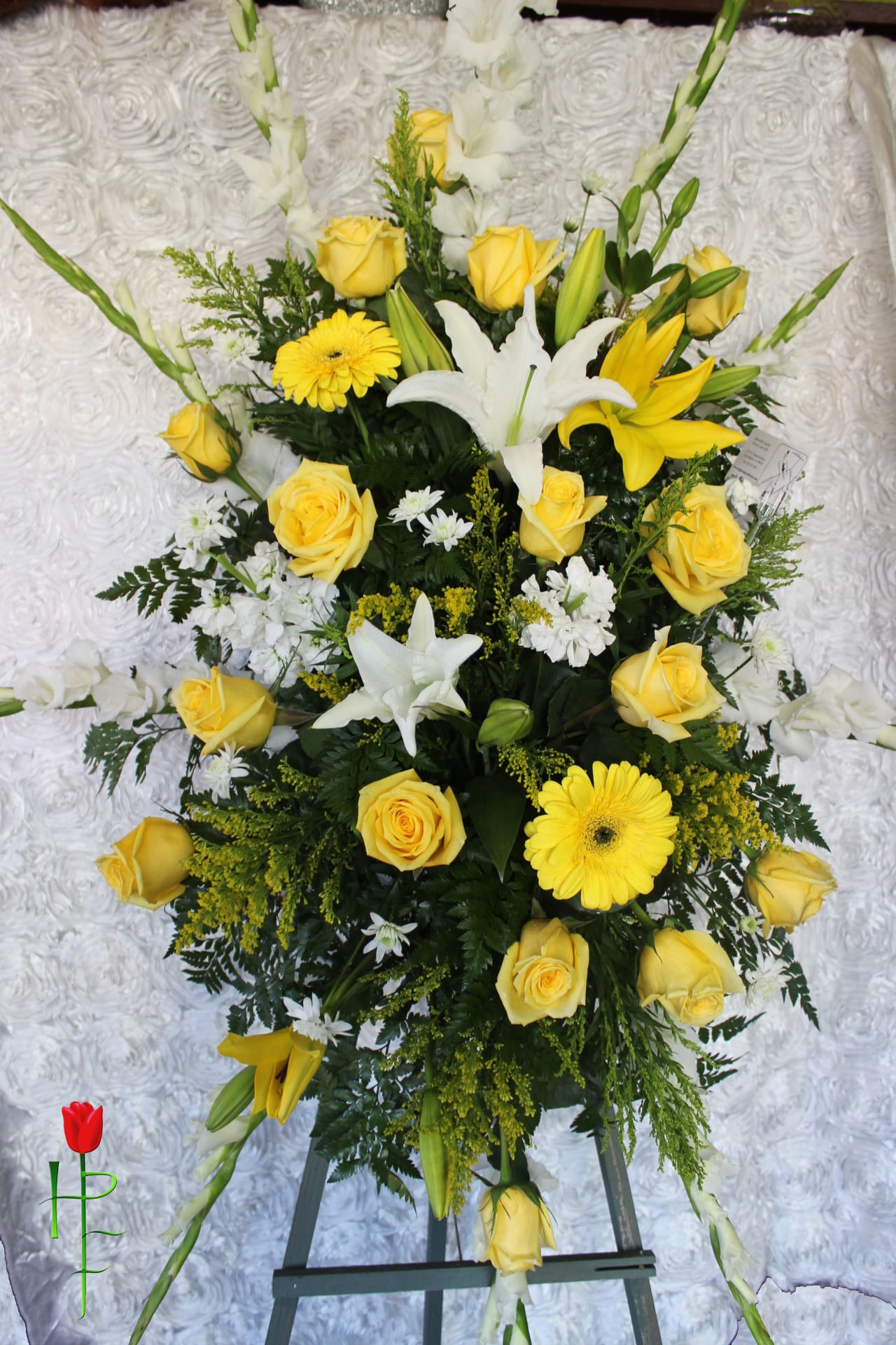 Funeral Spray Arrangement - This is our Funeral Spray Arrangement designed with a Mixture of Yellow and White Flowers. If you have any question about this piece, please give us a call. We can also make this Spray with any kind of Flowers/Colors.   *Order must be placed 2 - 3 days in advance* (Please note, same day pick-up or delivery is not available for this product) 