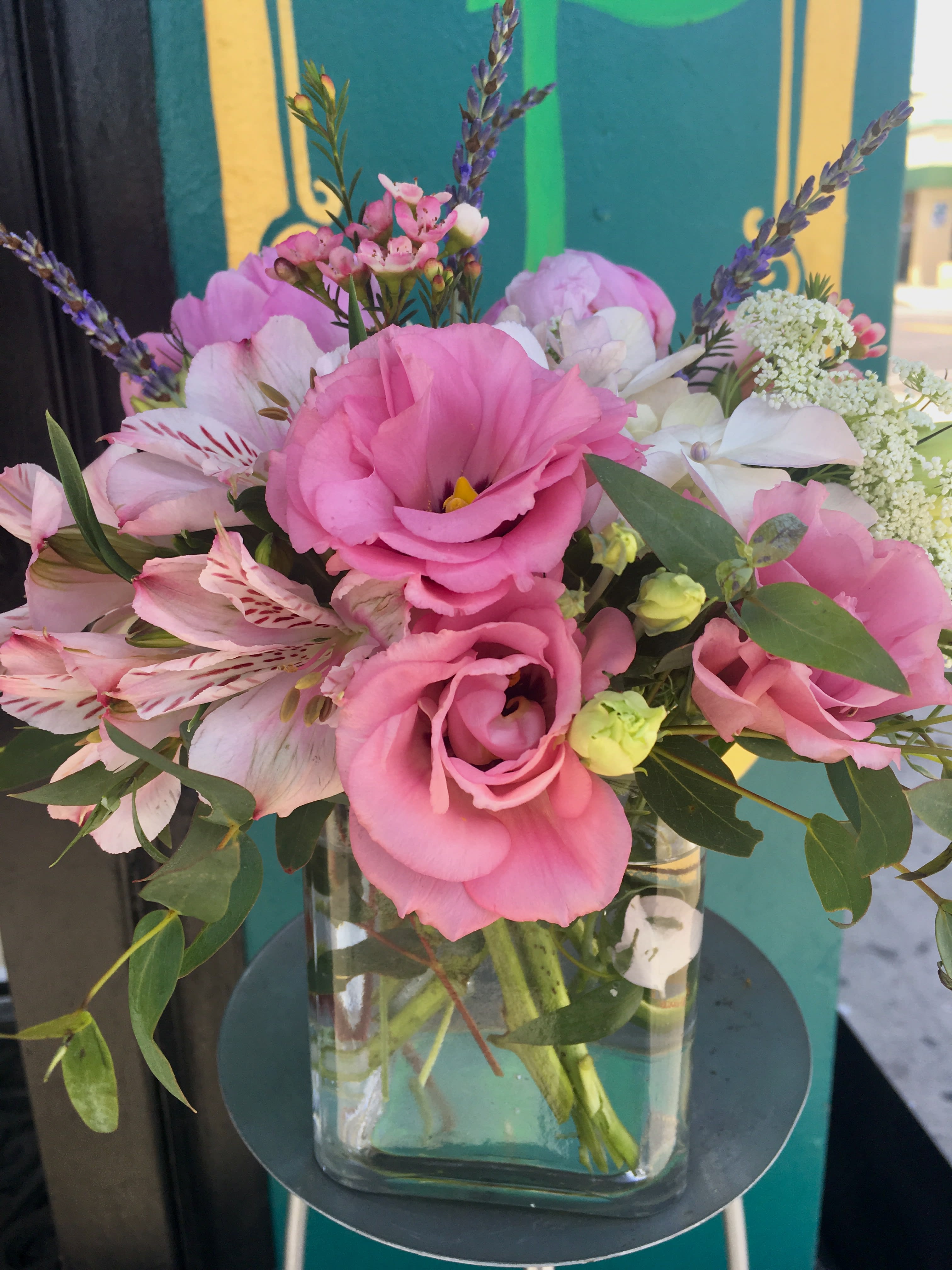 Pink and white bouquet in a clear glass vase