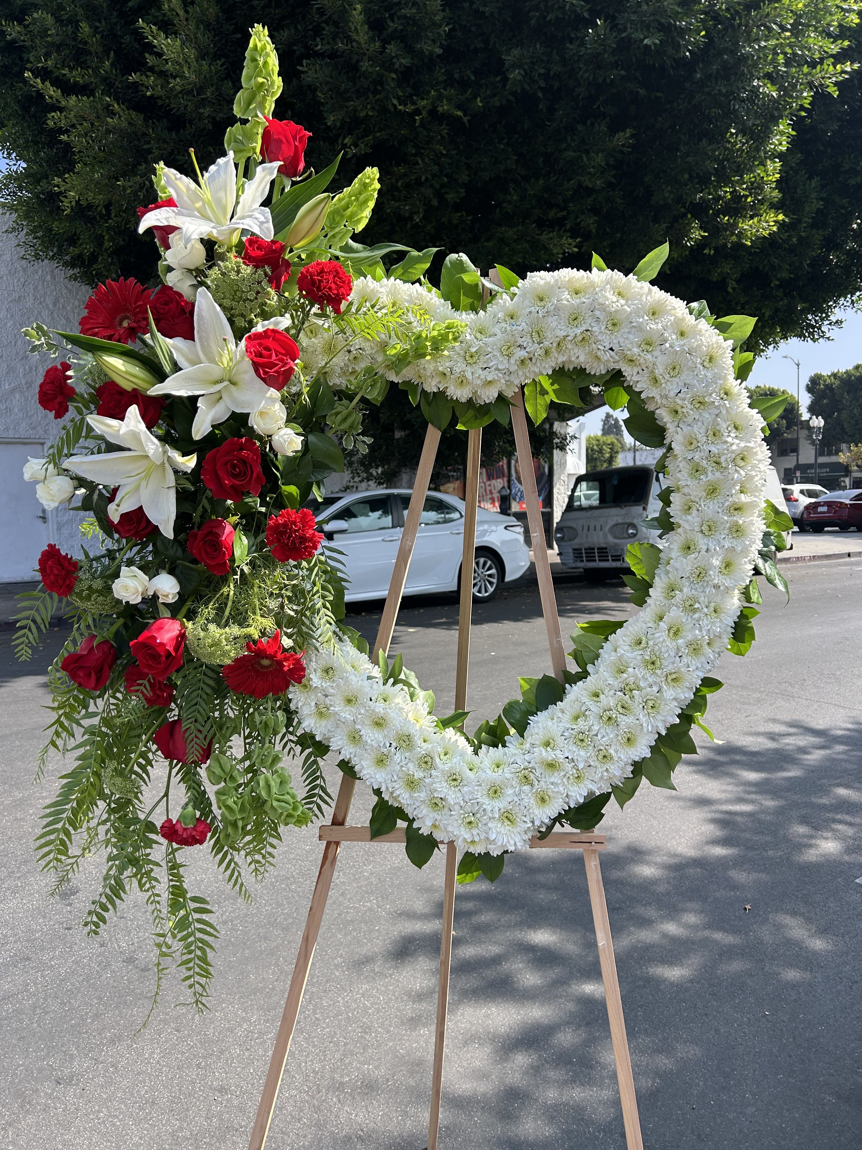 Red and White Love - Seasonal red and white flowers arranged into a heart easel.