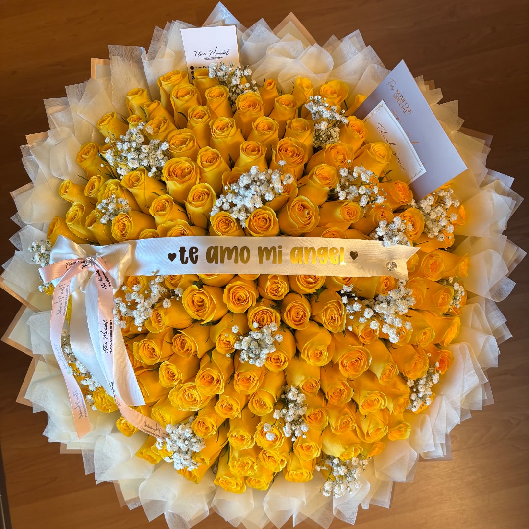 Large bouquet of yellow roses with white baby's breath and a ribbon