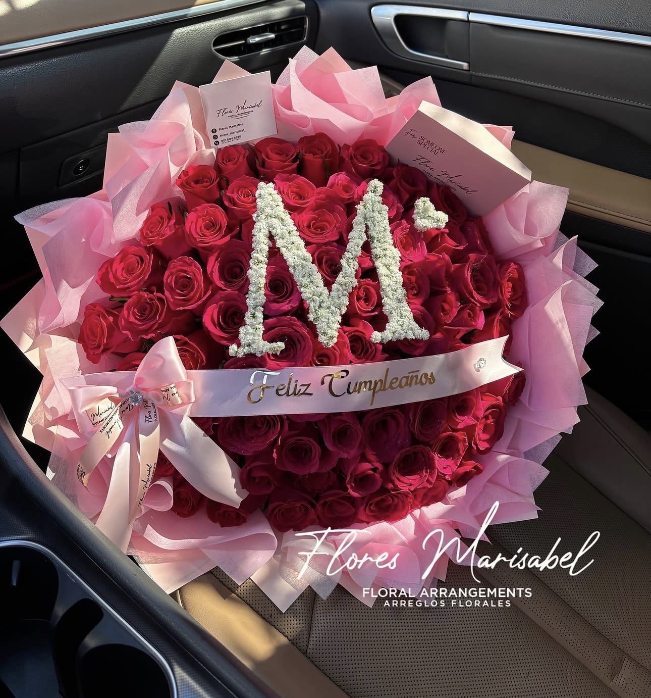 75 roses initial - 75 red roses. Pink layered wrap. Initial. (Does not include custom ribbon) *put desired initial in florist instructions. 