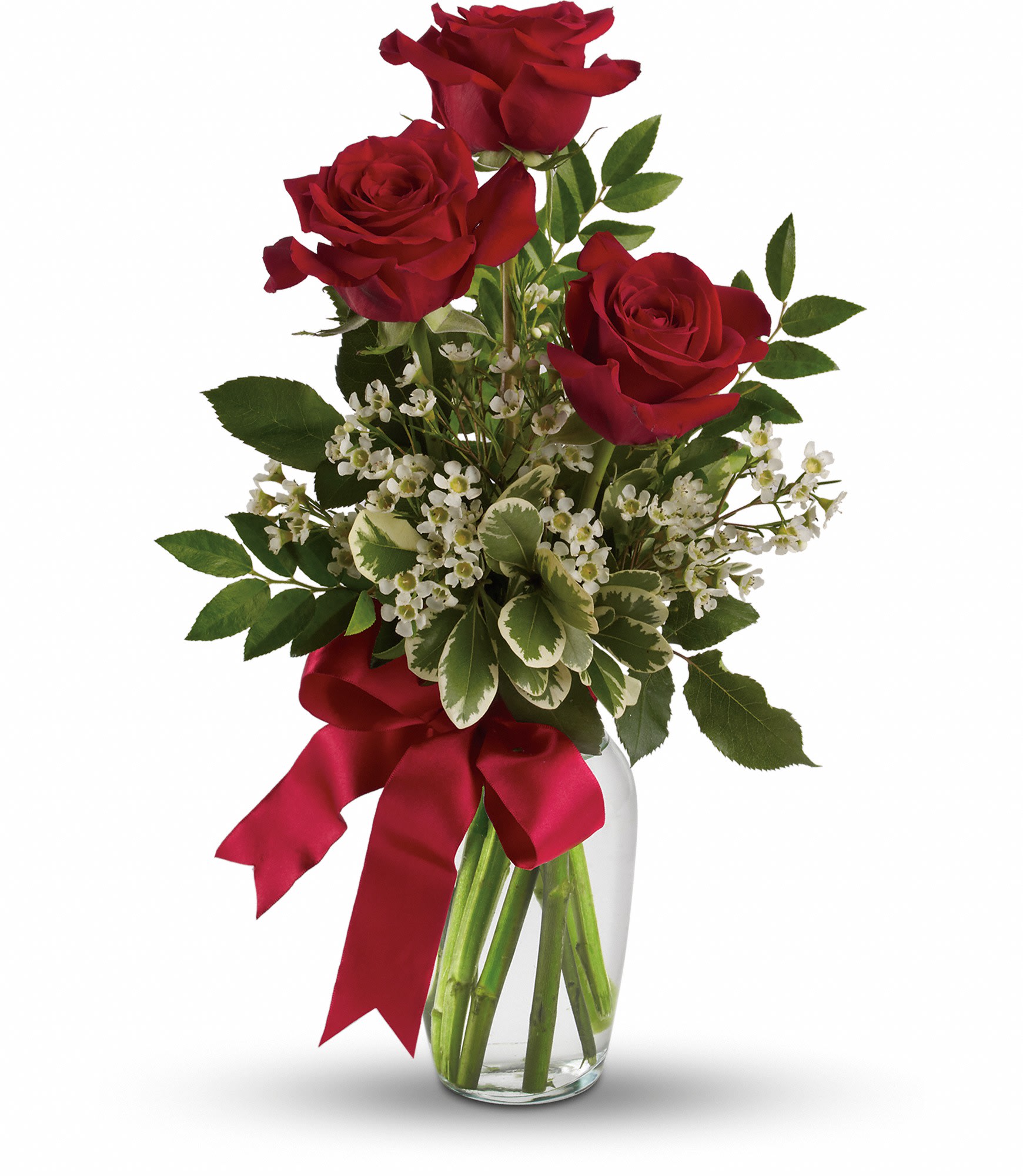 Red roses in a clear glass vase with a red ribbon