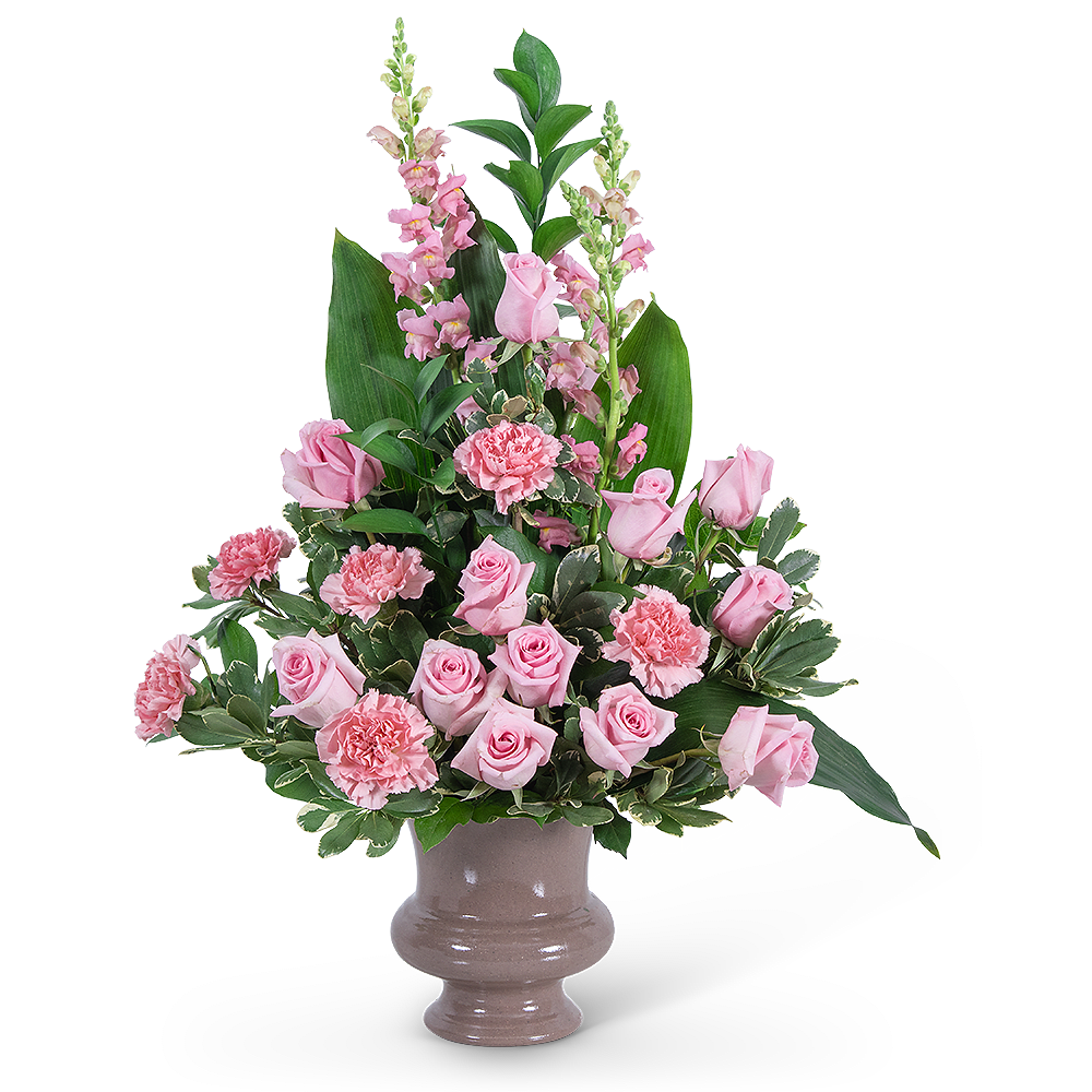 Pink roses and carnations in a ceramic vase