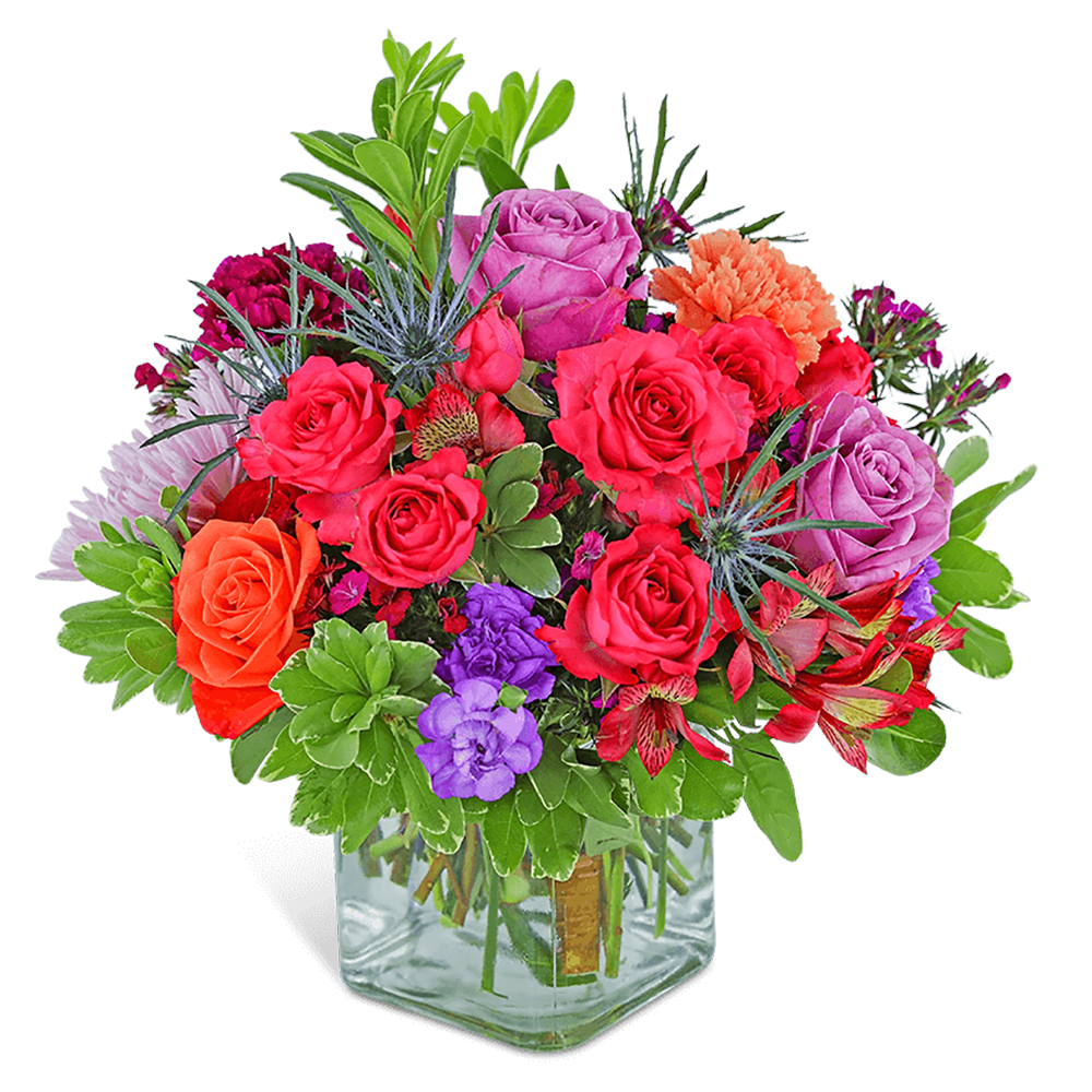 Colorful mixed bouquet in a clear square vase