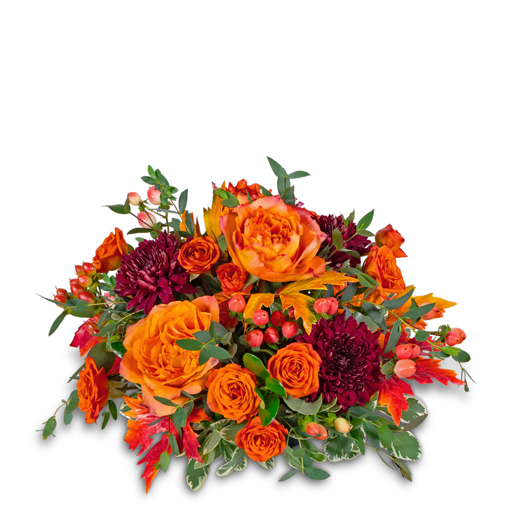 Orange roses and dark burgundy mums in a low autumn bouquet