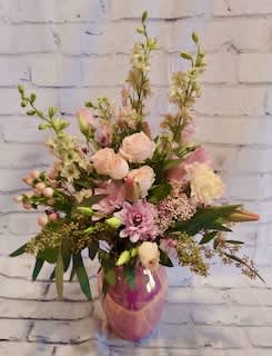 Pink and white mixed bouquet in a pink vase