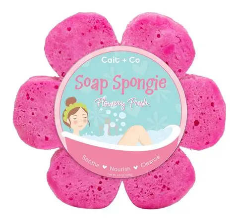 Pink flower-shaped soap sponge with a round label in the center