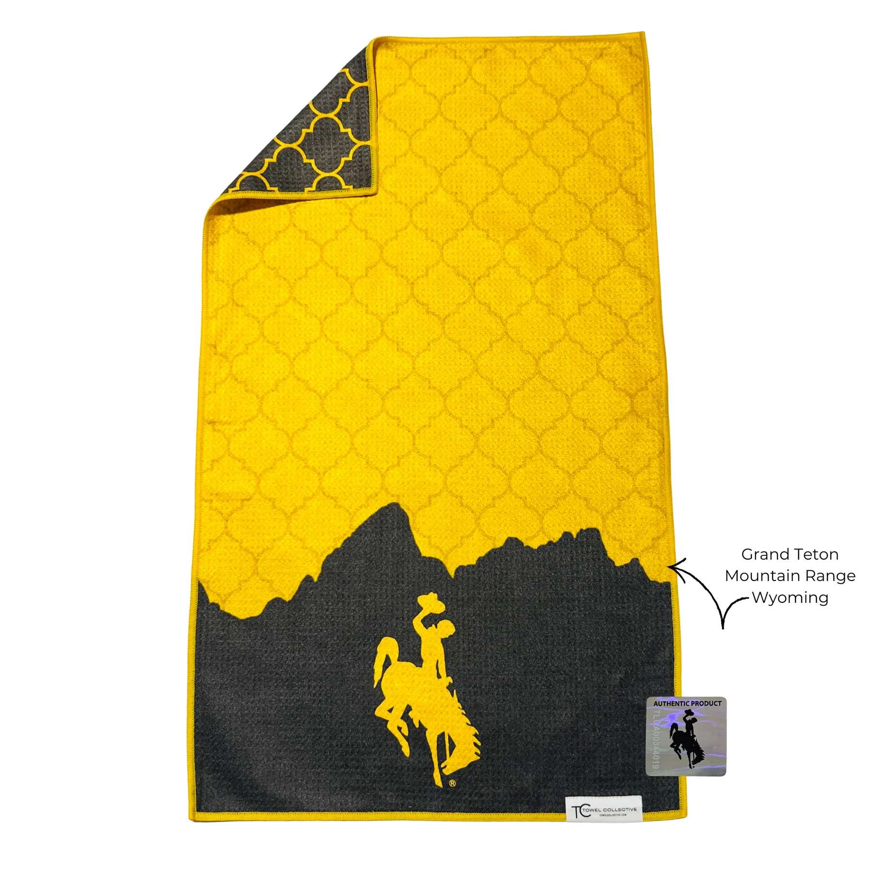 Yellow and black towel with a mountain silhouette and cowboy graphic