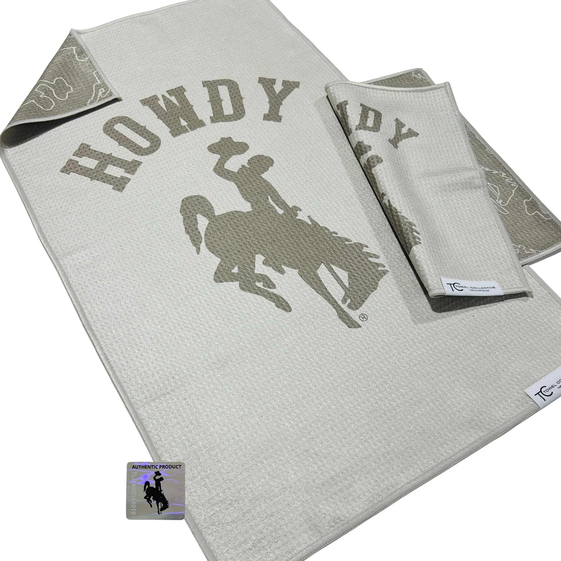 Gray towel set with a cowboy rider graphic and "Howdy" text