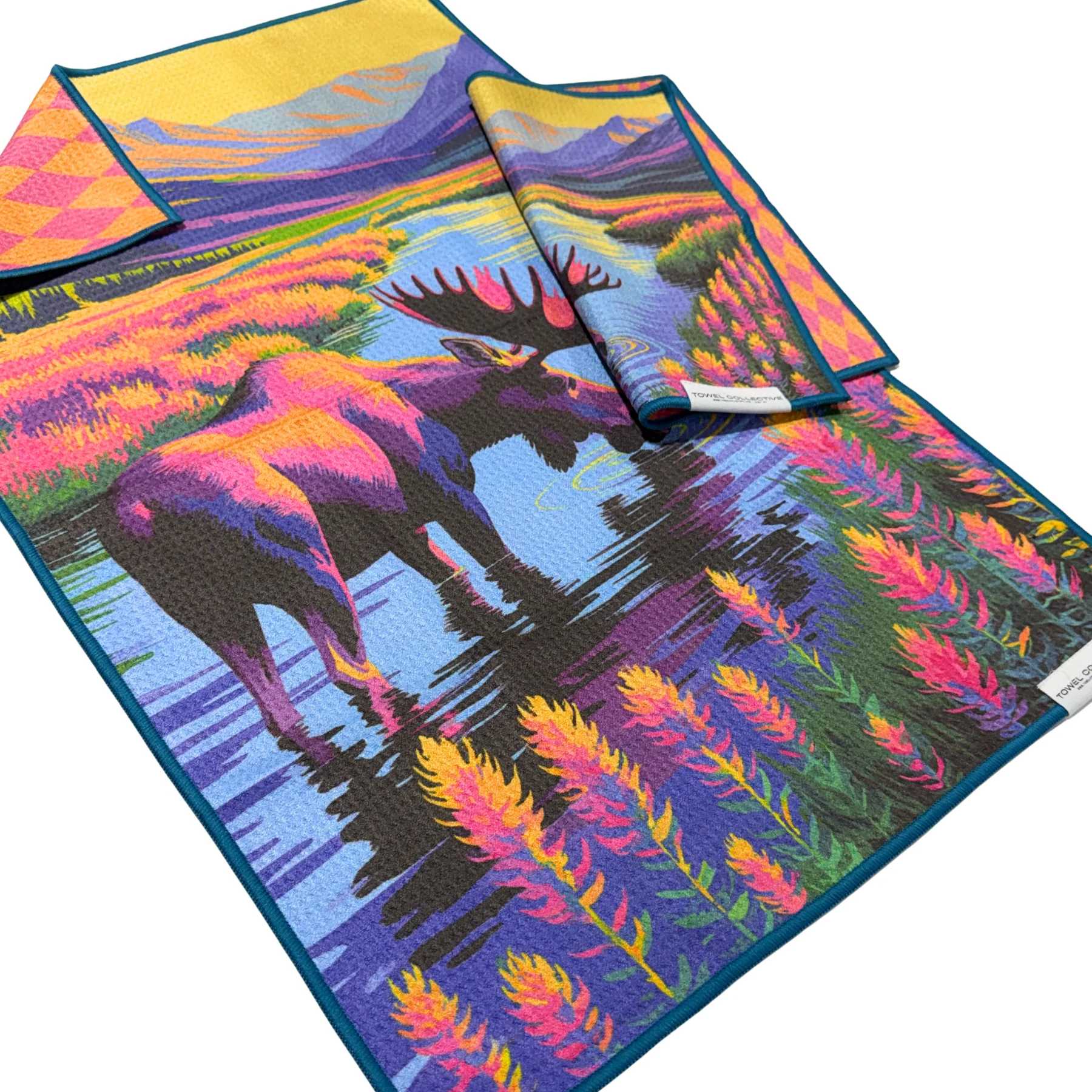 Colorful printed towels with a moose and mountain scene