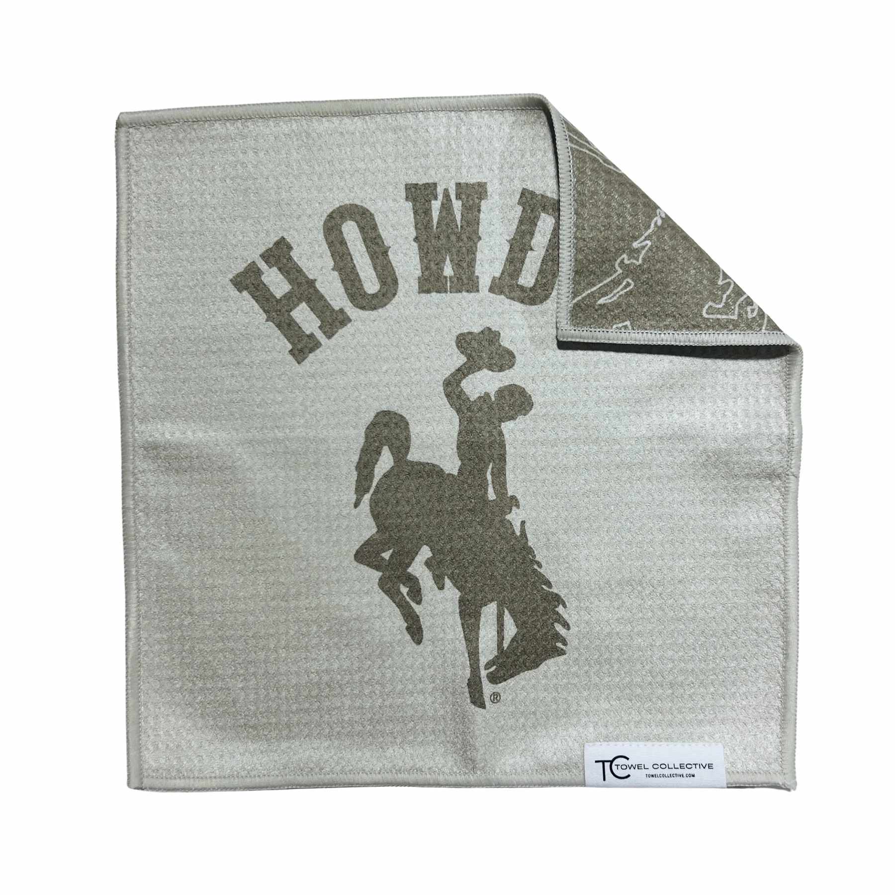 Gray blanket with a cowboy rider graphic and the word HOWD
