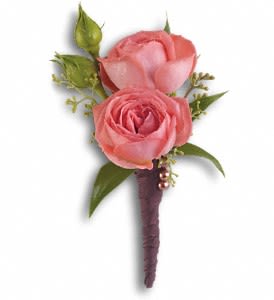 Rose Simplicity Boutonniere - A single coral rose is elegant and understated.  Coral roses, seeded eucalyptus and Italian ruscus bundled in a brown satin ribbon.  Approximately 3" W x 5" H  Orientation: N/A