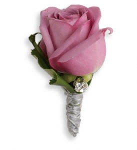 Roses And Ribbons Boutonniere - Keep it sweet and simple with a singularly stunning lavender rose and rhinestone accents.  A lavender rose and galax leaf accented with rhinestones.  Approximately 2" W x 3" H  Orientation: N/A