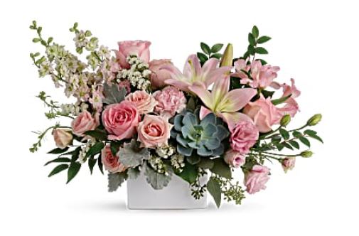Pink roses and lilies in a white rectangular vase