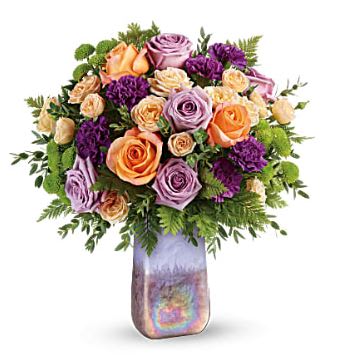 Mixed roses and purple blooms in a iridescent vase