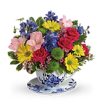 Dutch Garden Teacup Bouquet  - Hot pink spray roses, light pink alstroemeria, blue delphinium, green button spray chrysanthemums and yellow daisy spray chrysanthemums are accented with lavender waxflower and variegated pittosporum.  This delightful arrangement is created fresh by the talented Floral Designers at Denver's Best Florist, Floral Expressions!  