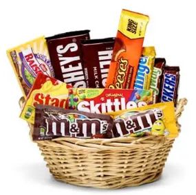 Basket filled with assorted candy bars and chocolate packs