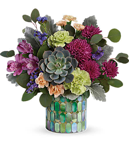 Mixed bouquet with succulents and purple flowers in a mosaic vase