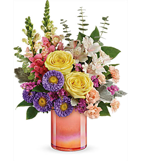 Mixed bouquet in a pink glass vase with yellow roses and purple daisies