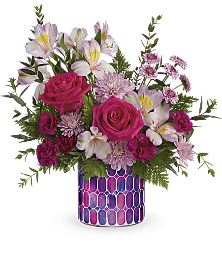 Pink roses and pale lilies in a patterned vase