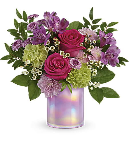 Lovely Lilac Bouquet - Lovely as can be! Celebrate the new season with this majestic mix of deep pink roses and spring-happy blooms, artfully arranged in a shimmering, iridescent glass keepsake vase. 