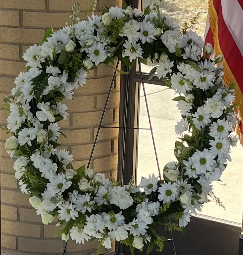 White daisy wreath on a standing easel