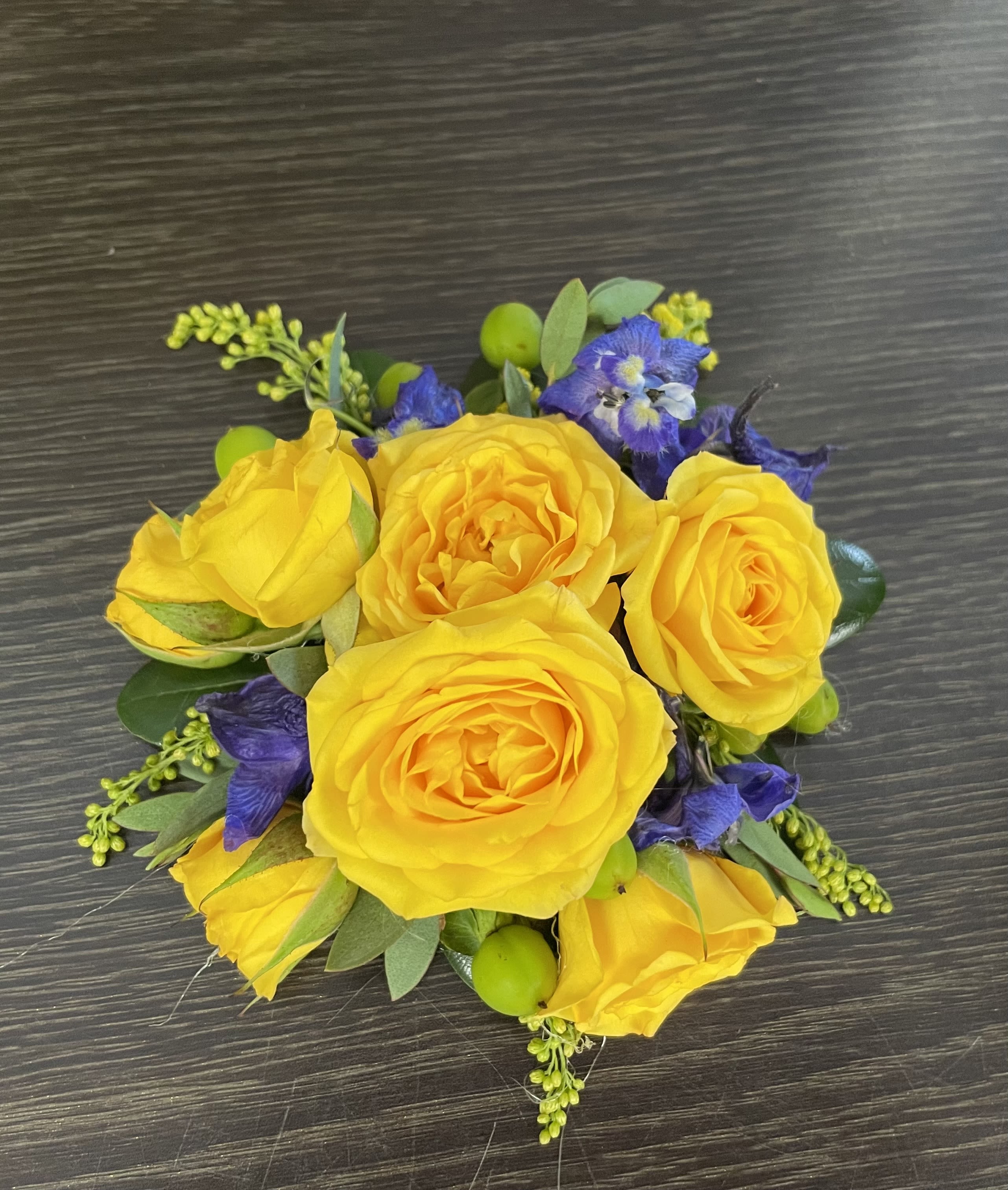Yellow rose bouquet with purple flowers and green accents