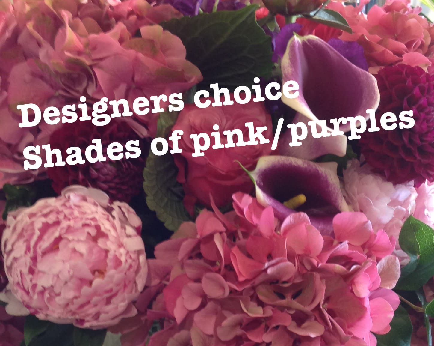 Close-up of a designer's choice pink and purple bouquet with hydrangeas, dahlias, peonies, and calla lilies