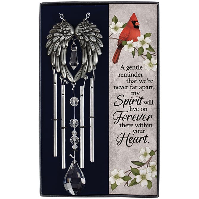 Memorial wind chime with silver angel wings and a cardinal-themed sympathy card