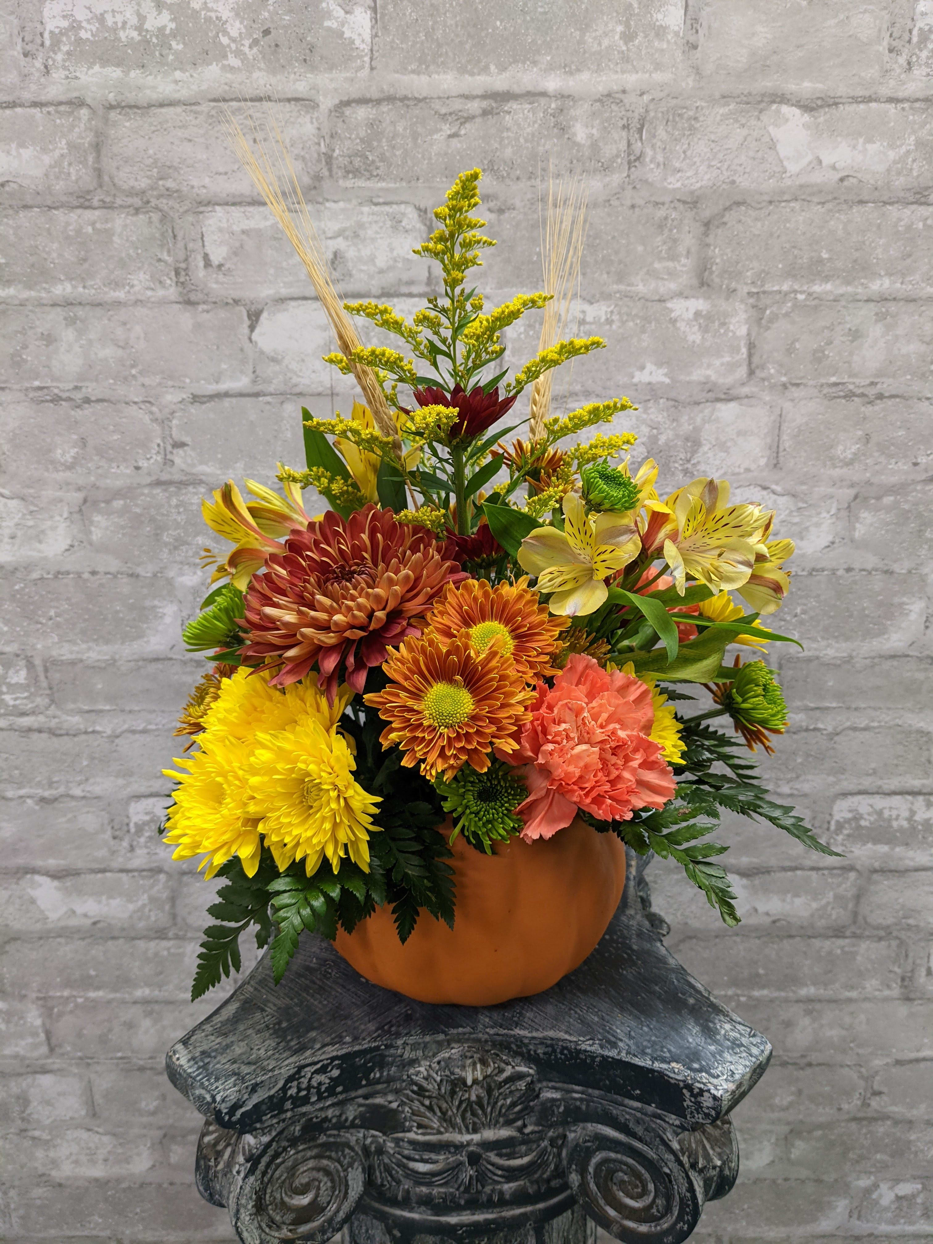 Country  Pumpkin FG651 - Keepsake pumpkin holds the pretty fall colored flowers of browns, rust, orange and red.  Approximately 14" H X 8" W.