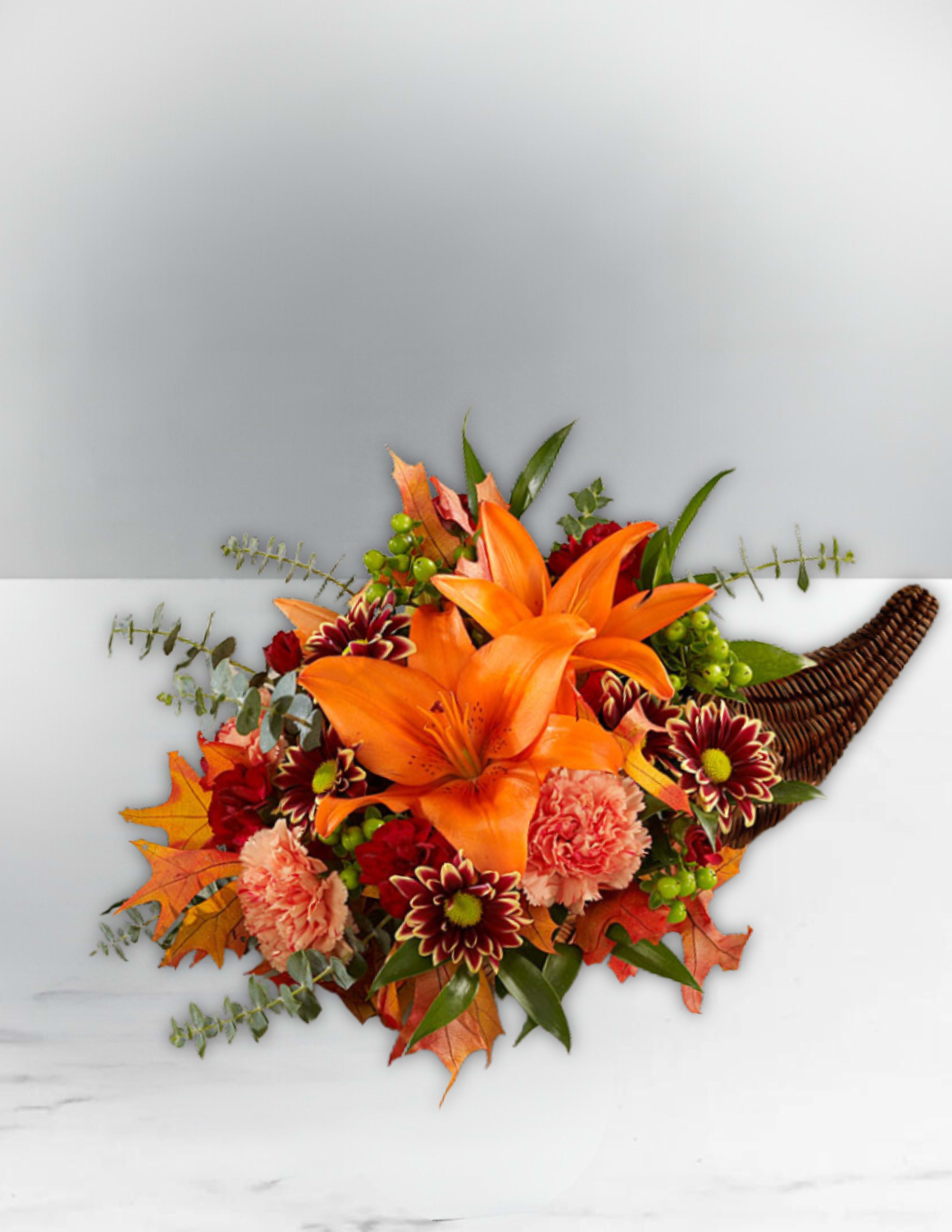 Thanksgiving Cornucopia arrangement  - Thanksgiving Cornucopia arrangement featuring orange lilies, carnations, Daisies, and fall filler flowers.