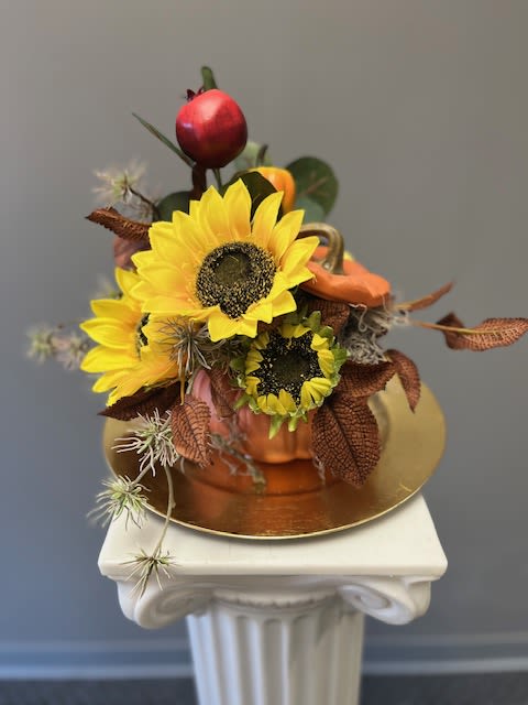 EVERLASTING AUTUMN - The highest quality silk flowers designed in an orange ceramic pumpkin. This will be the perfect addition to your Fall home decor.