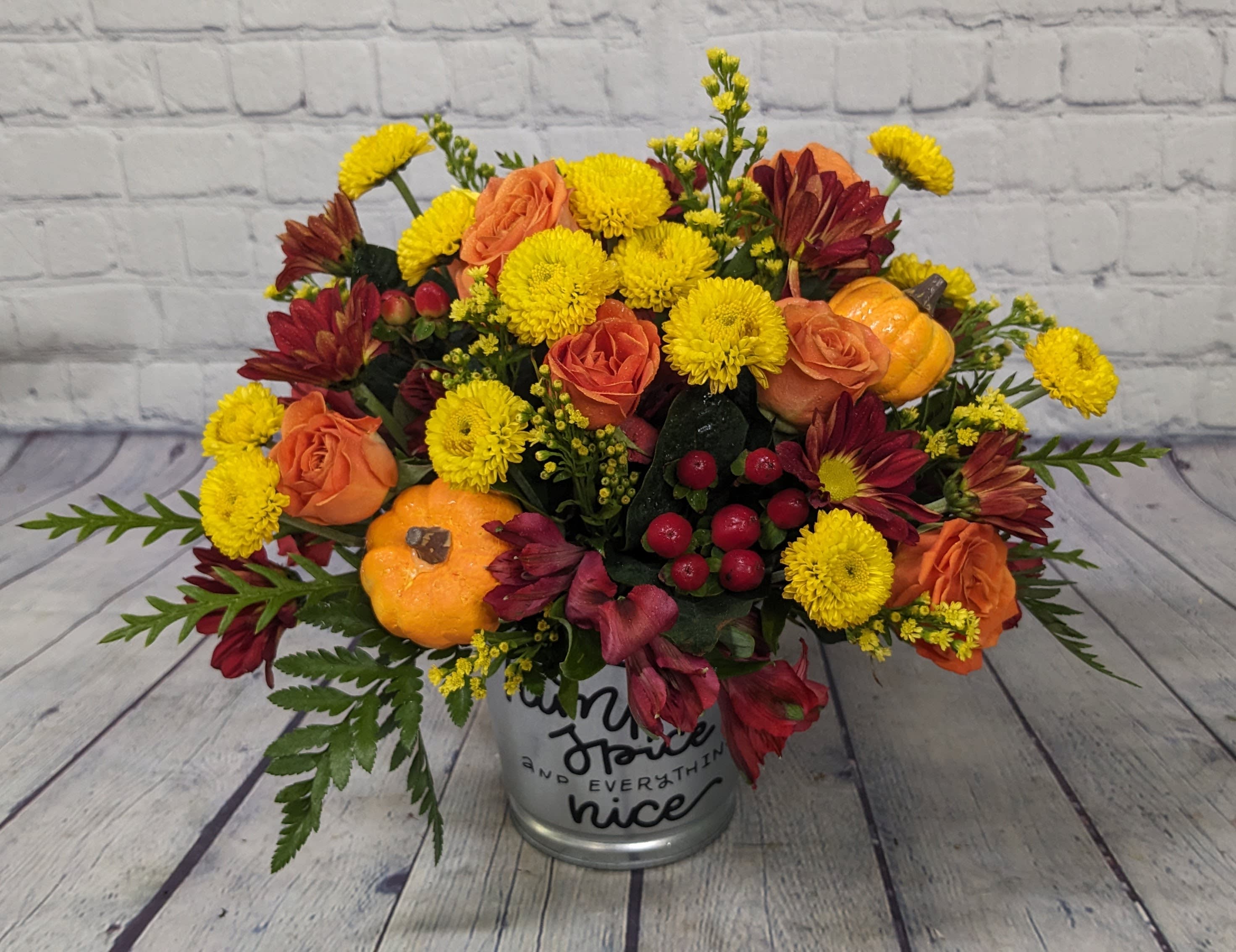 Pumpkin Spice - This bouquet is full of Pumpkin Spice &amp; everything nice. From sunflowers to spray roses, daisies, and alstroemeria, this bouquet is adorable and sure to bring a smile this season.  Tin decorative container says, "Pumpkin Spice &amp; everything nice".