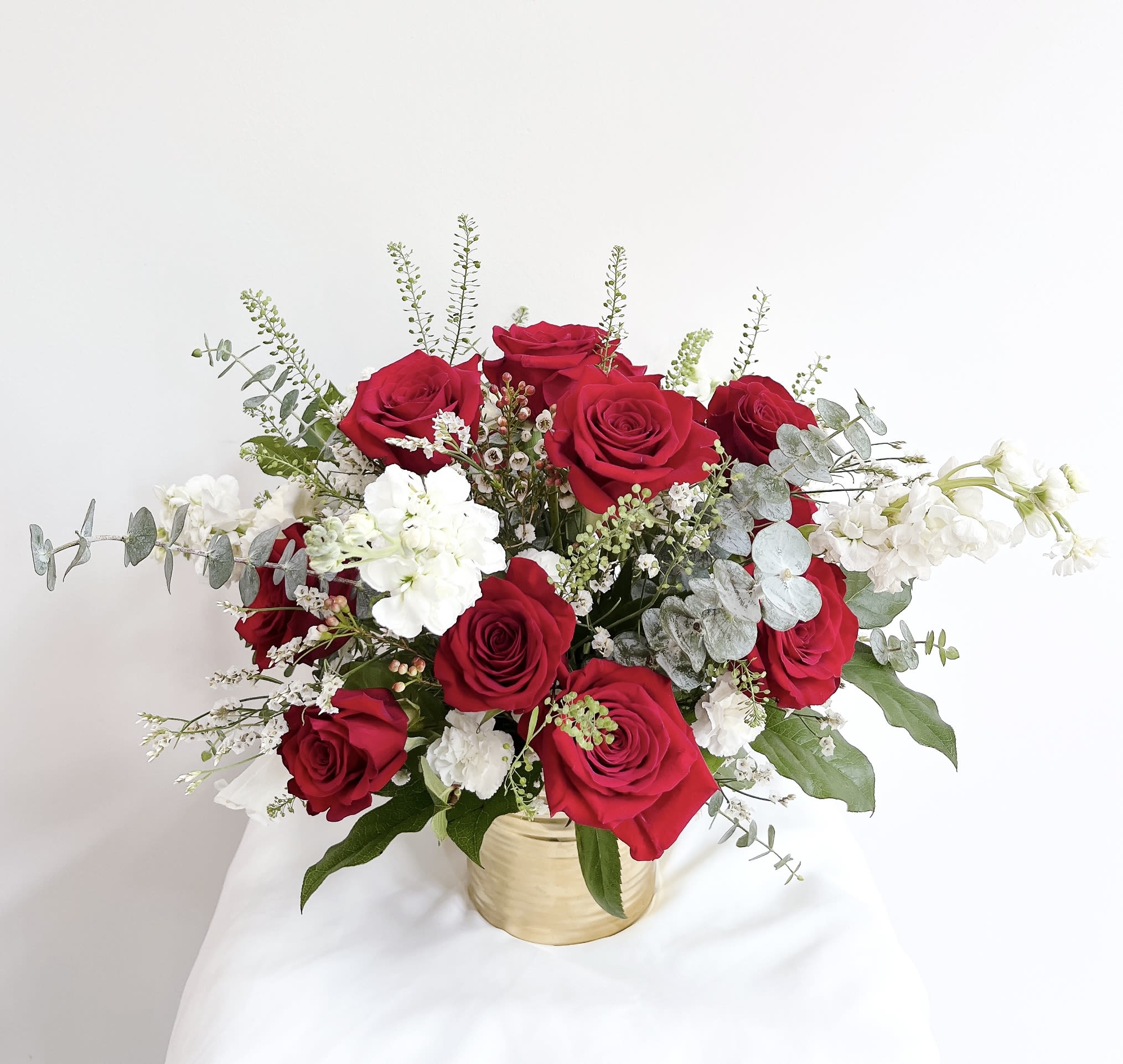 Timeless Love Premium Red Rose - Enclosed in a warm, glowing gold vase, this arrangement sets the perfect stage for an unforgettable romantic gesture, designed to express your deepest feelings and make a lasting impression on that special someone.