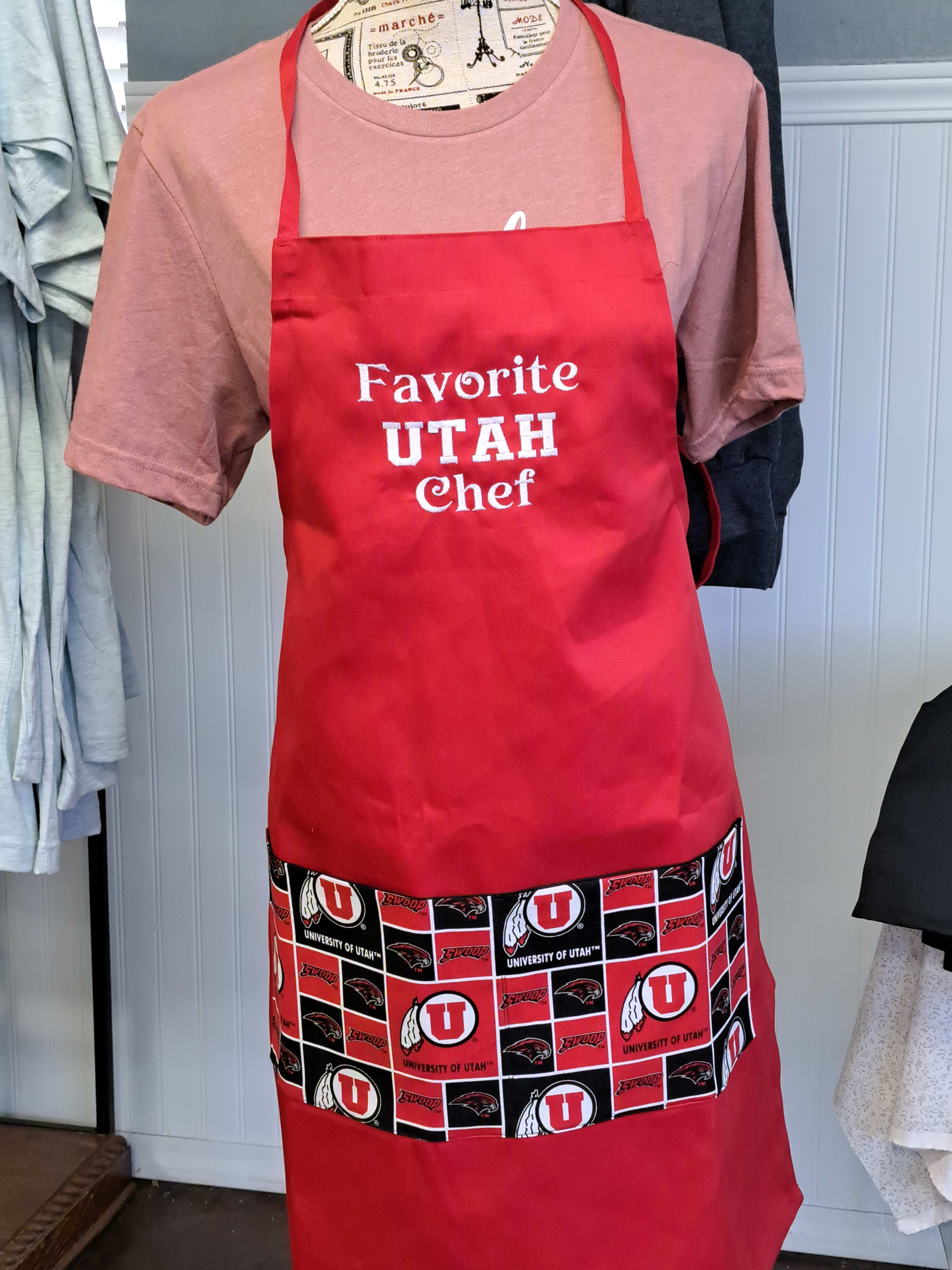 Red apron with "Favorite Utah Chef" text and University of Utah logos