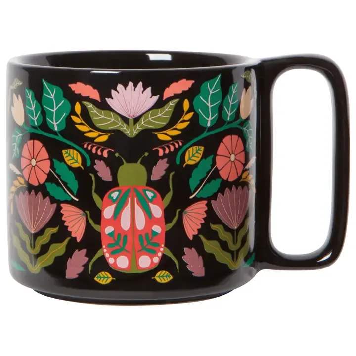 Amulet Midi Mug - Create convivial conversation over a cup of your favorite hot beverage with our Amulet Midi Studio Mug. Featuring the protective presence of a sacred scarab beetle and tendrils of lush, healing herbage, these finely crafted drinking vessels have been designed to nurture both the body and soul.  • SIZE: 11 oz • MATERIAL CONTENT: 100% Stoneware • CARE INSTRUCTIONS: Dishwasher &amp; microwave safe
