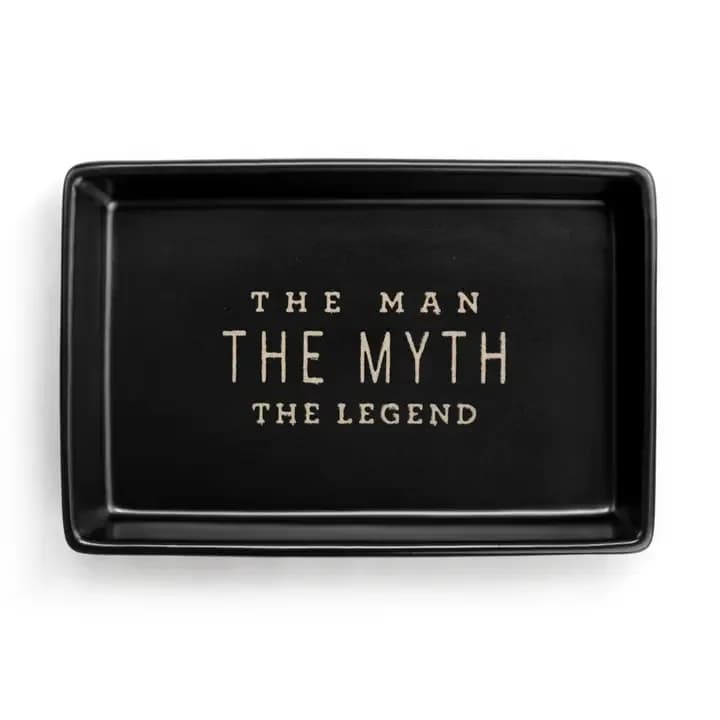 The Man Tray - Meet The Man Tray from DEMDACO, a stylish and purposeful addition to your home decor. This decorative tray is not just a functional piece, but also a testament to our brand's commitment to designing and curating items that lift the spirit. Handcrafted by artisans, it serves as a constant reminder to nurture goodness and inspire others. Perfect for tabletop decor, this tray is sure to put a smile on your face every time you use it.