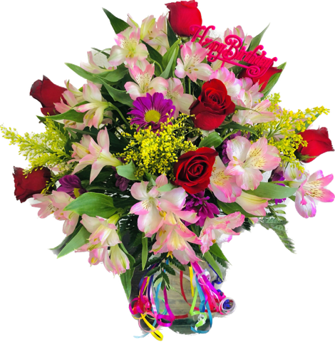 Bouquet of red roses and pink alstroemeria in a glass vase with a birthday pick