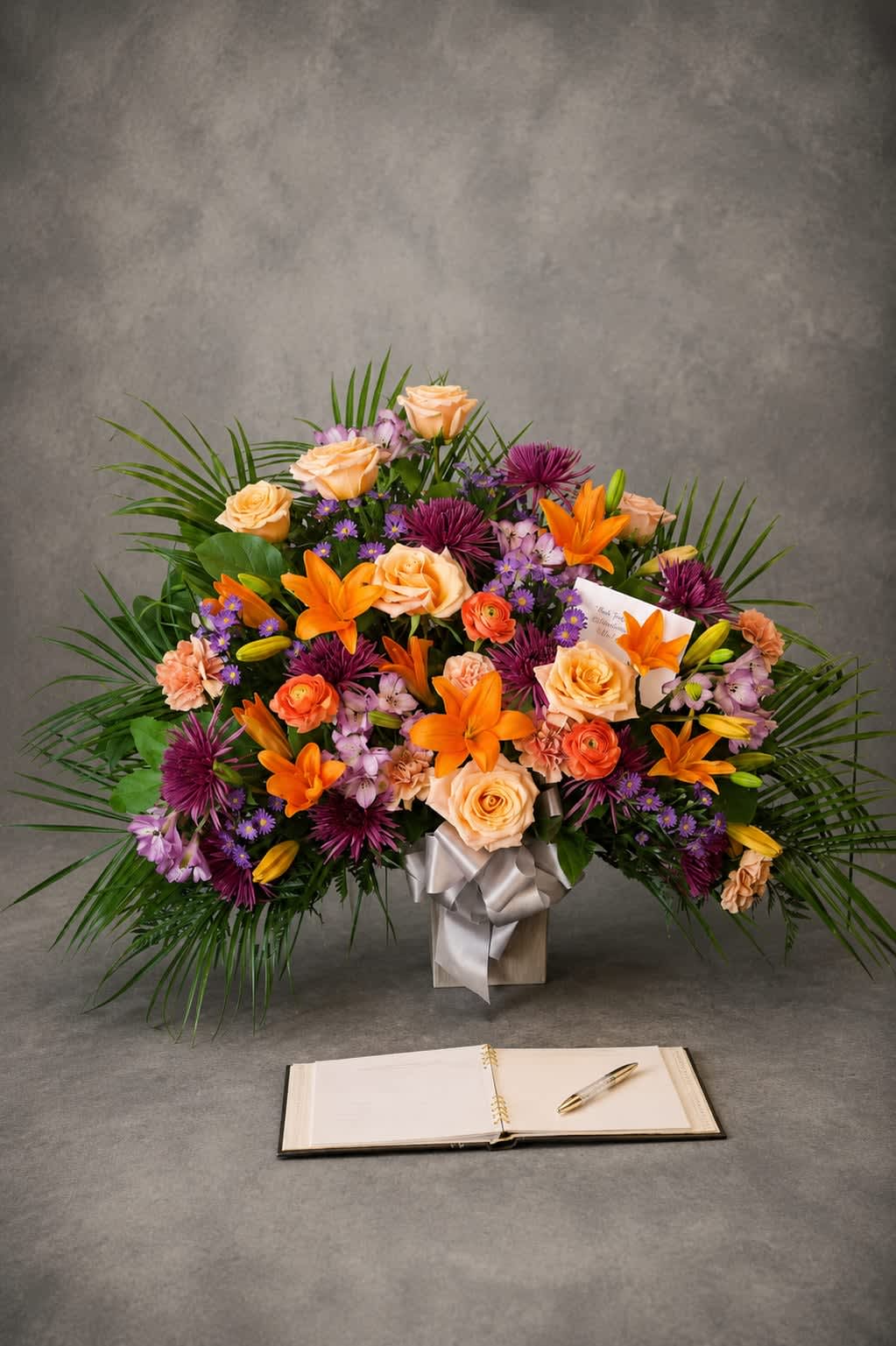 Garden of Remembrance - A vibrant gathering of lilies, roses, mums, and seasonal flowers arranged with warmth and elegance. Garden of Remembrance offers a meaningful expression of sympathy while honoring a lifetime of beautiful memories.
