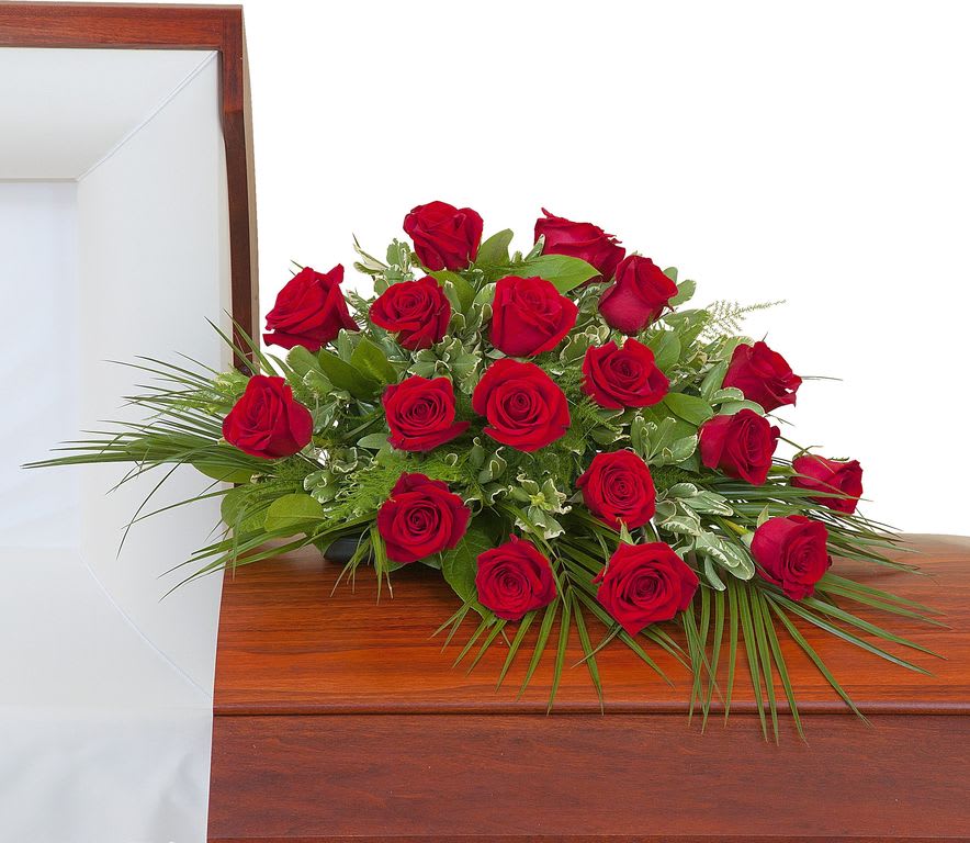 Simply Roses  Casket Spray -  - Eighteen Roses in a casket spray. Approximately 18"W 12"D