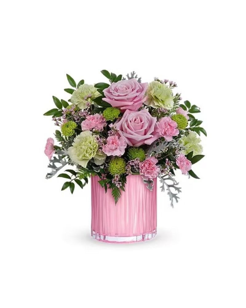Rosy Pink Bouquet - Rosy, radiant and perfectly posh! This Rosy Pink Bouquet with a fabulously feminine arrangement in a pearlescent pink glass vase with sculpted details is the perfect Mother's Day surprise. Pink roses, pink spray roses, pink alstroemeria, miniature hot pink carnations, lavender button spray chrysanthemums and large purple monte cassino asters are arranged with dusty miller and huckleberry. This Mother's Day bouquet is delivered in a pink vase. Orientation: All-Around Container may vary 