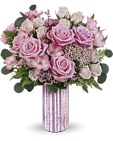 Amazing Pinks Bouquet - Sparkle with elegance and grace with Amazing Pinks bouquet, nestled in the stunning lavender mercury-inspired finish vase, a timeless adornment perfect for Mother's Day and all year round.. Amazing Pinks Bouquet showcases a blend of pink roses, light pink spray roses, pink alstroemeria, pink carnations, leatherleaf fern, pink limonium, rice flower, and silver dollar eucalyptus, delivering a stunning Mother's Day gift in elegant lavender hues. Orientation: All-Around Container may vary