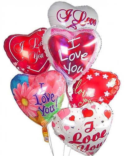 Cluster of heart-shaped Valentine balloons with love messages