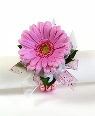 Pink gerbera daisy bouquet with decorative ribbon
