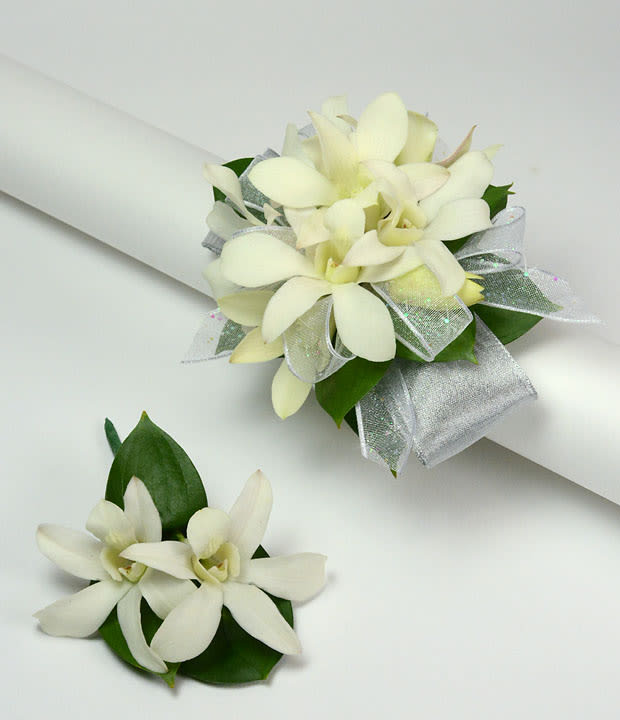 White orchid corsage and boutonniere with silver ribbon